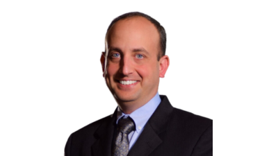 Professional headshot of a male in a suit